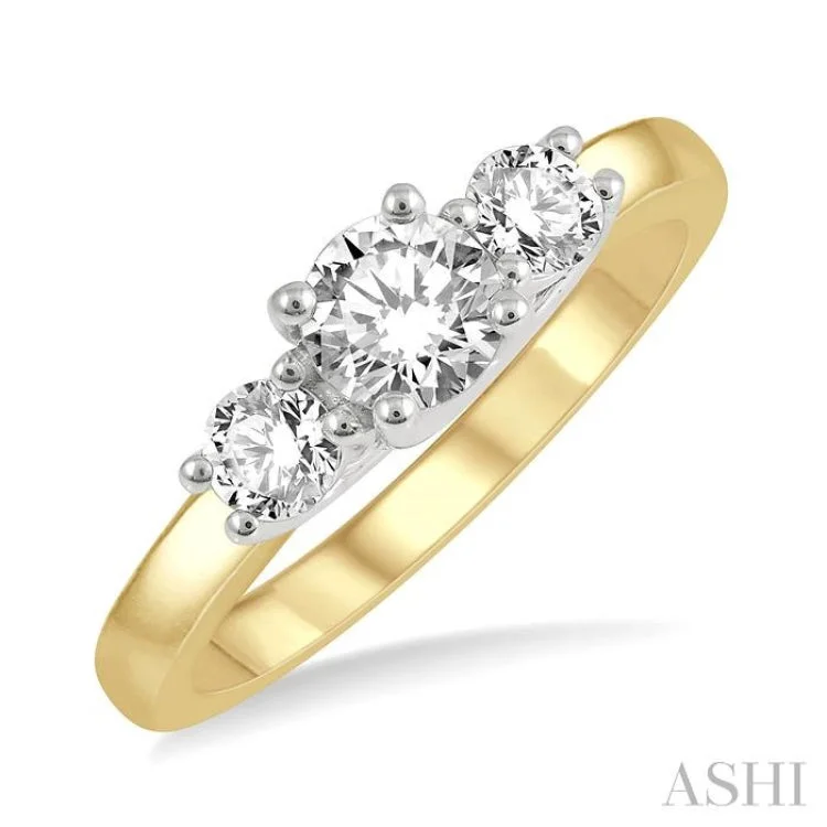 3/4 ctw Round Cut Diamond Three-Stone Ring in 14K Yellow and White Gold